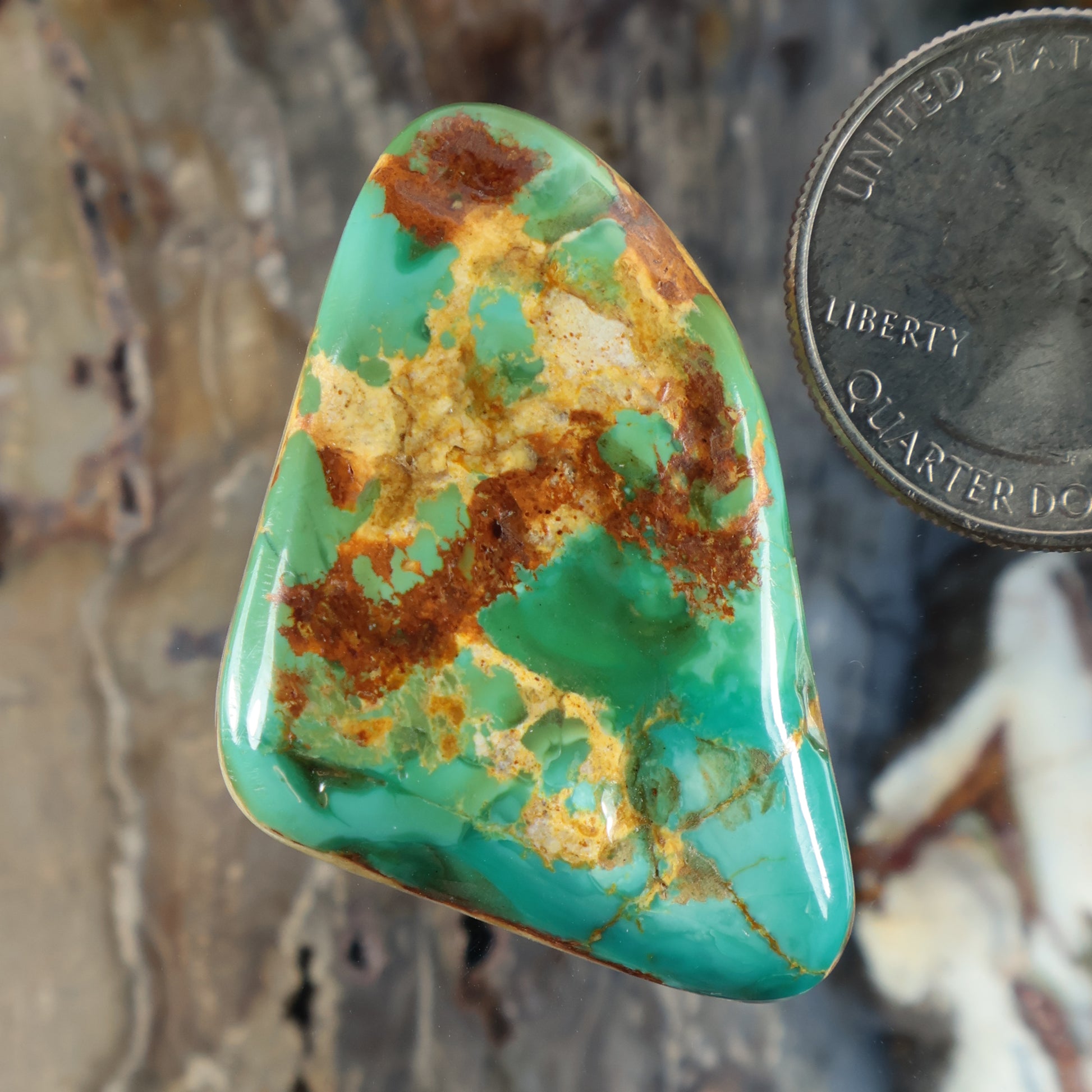 Turquoise cabochon gemstone, teardrop shape with green and brown matrix