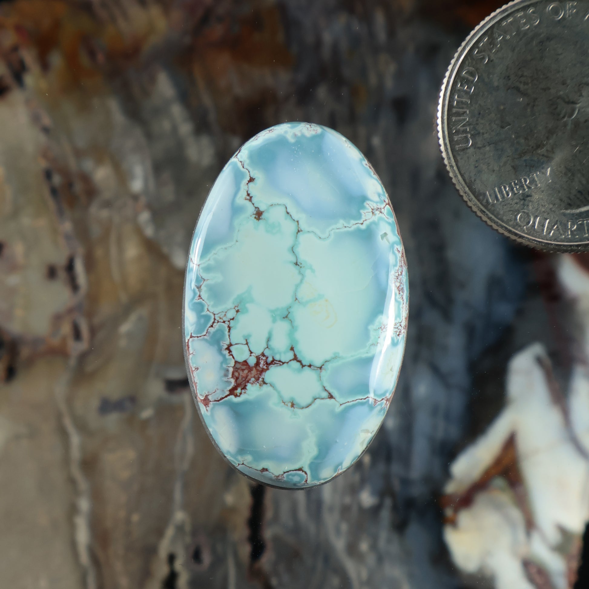 Oval turquoise cabochon with matrix webbing in light blue