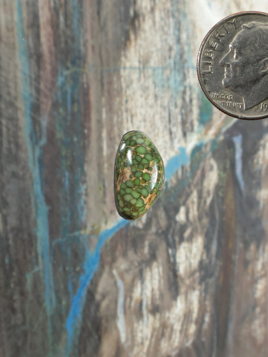 Damele variscite cabochon, oval green gemstone with honeycomb mosaic pattern.