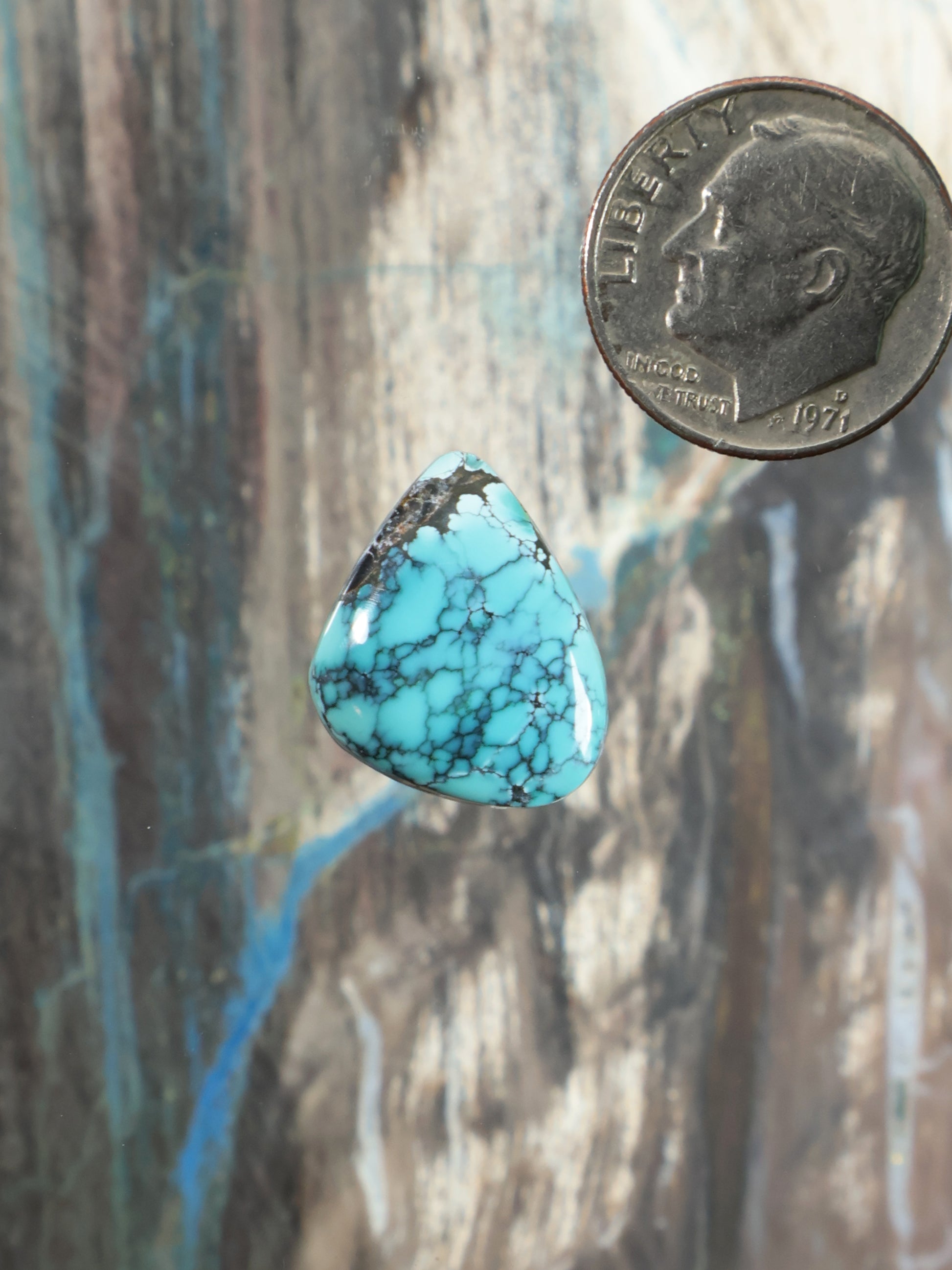 Turquoise cabochon gemstone, teardrop-shaped with blue matrix pattern