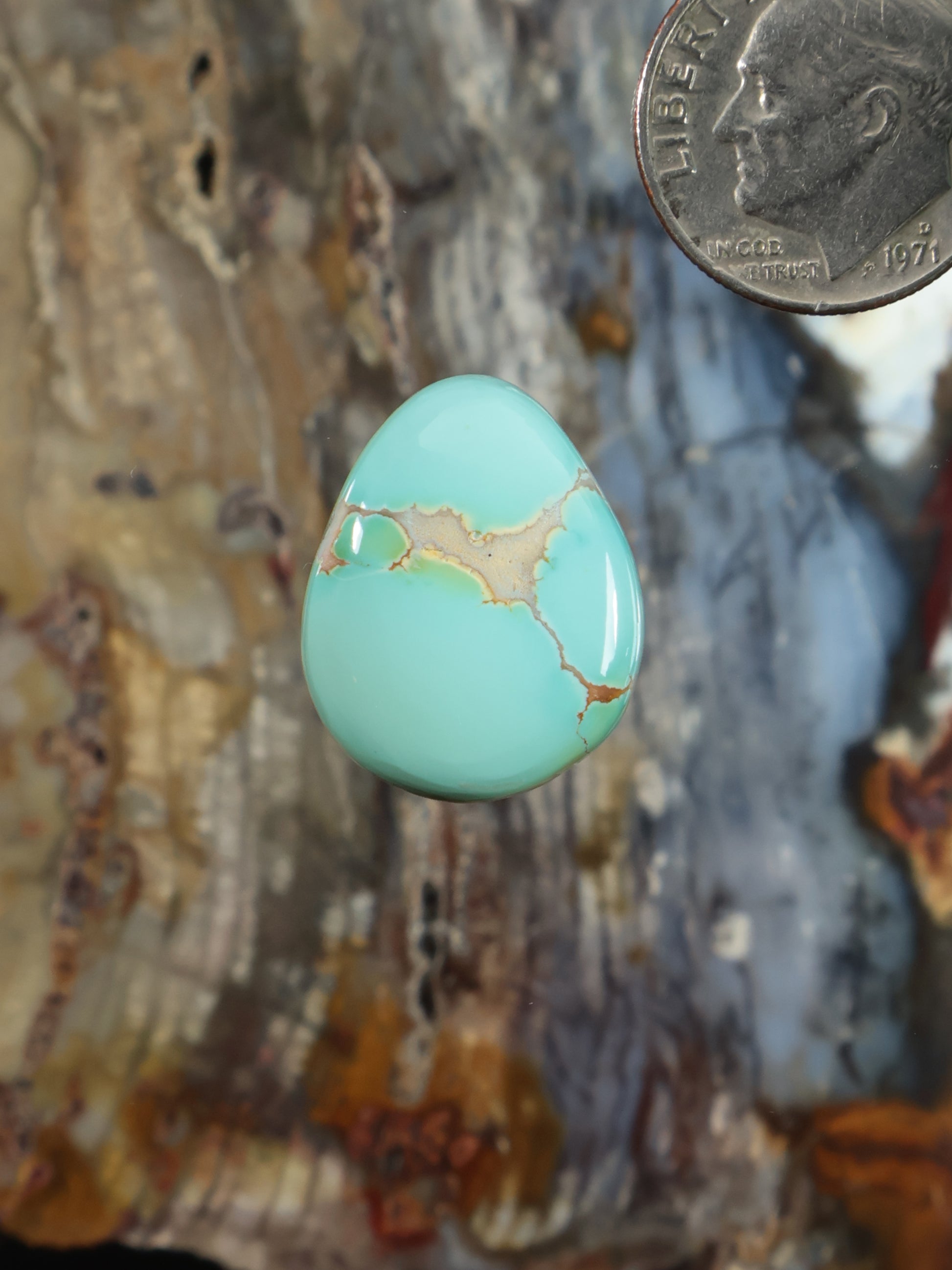 Thunderbird turquoise cabochon, teardrop with light matrix veining