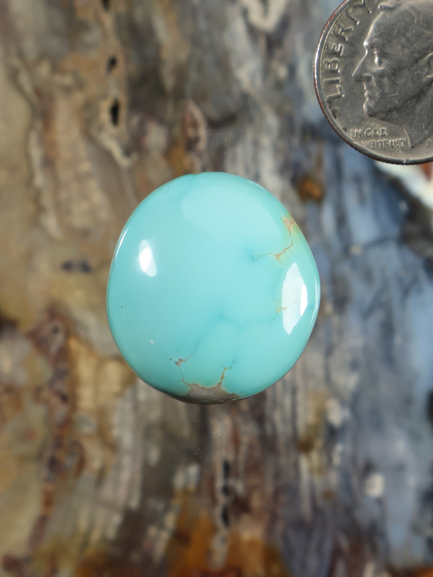 Turquoise oval cabochon gemstone with smooth polished surface