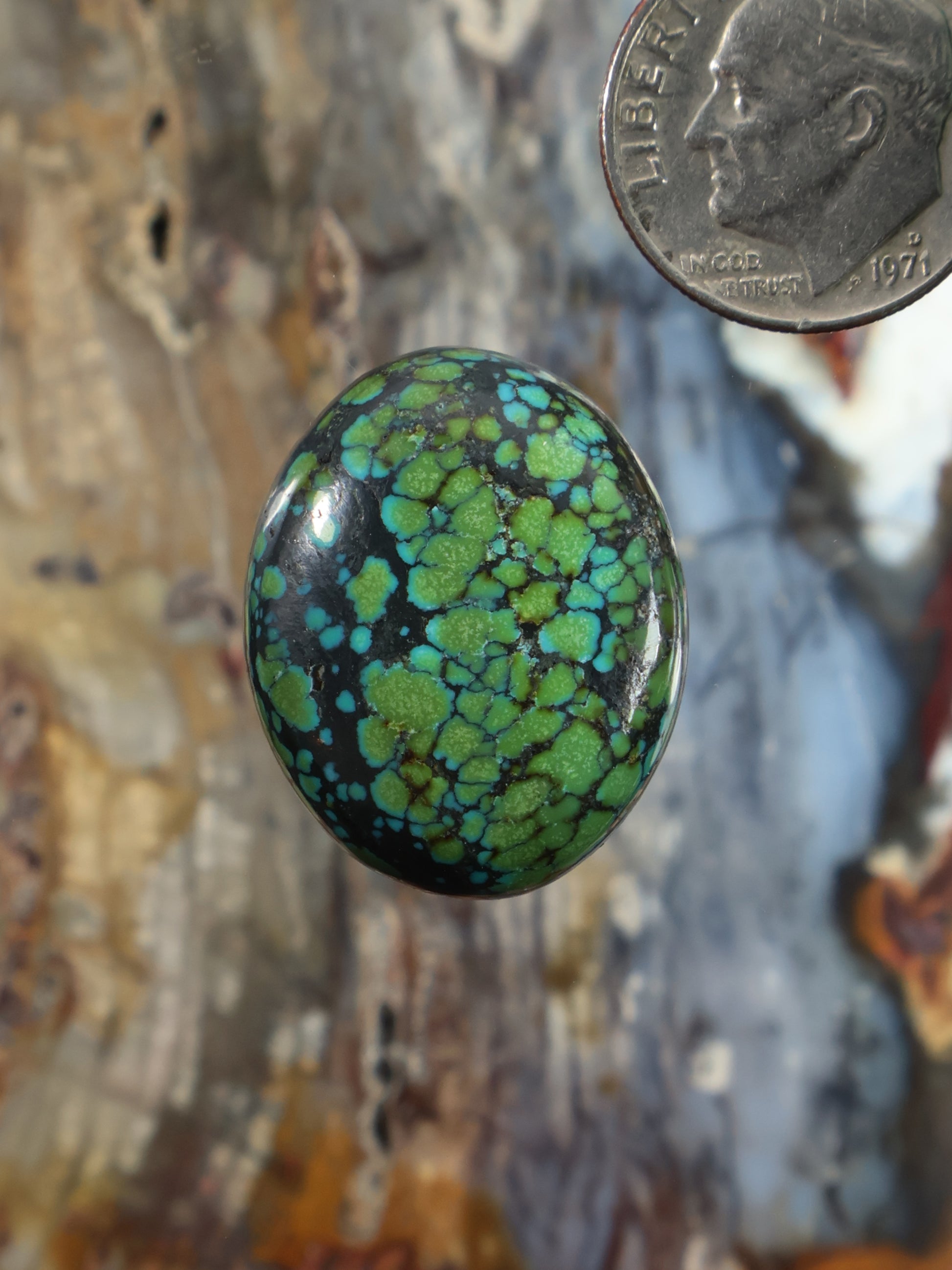 Turquoise cabochon gemstone, round with green web pattern