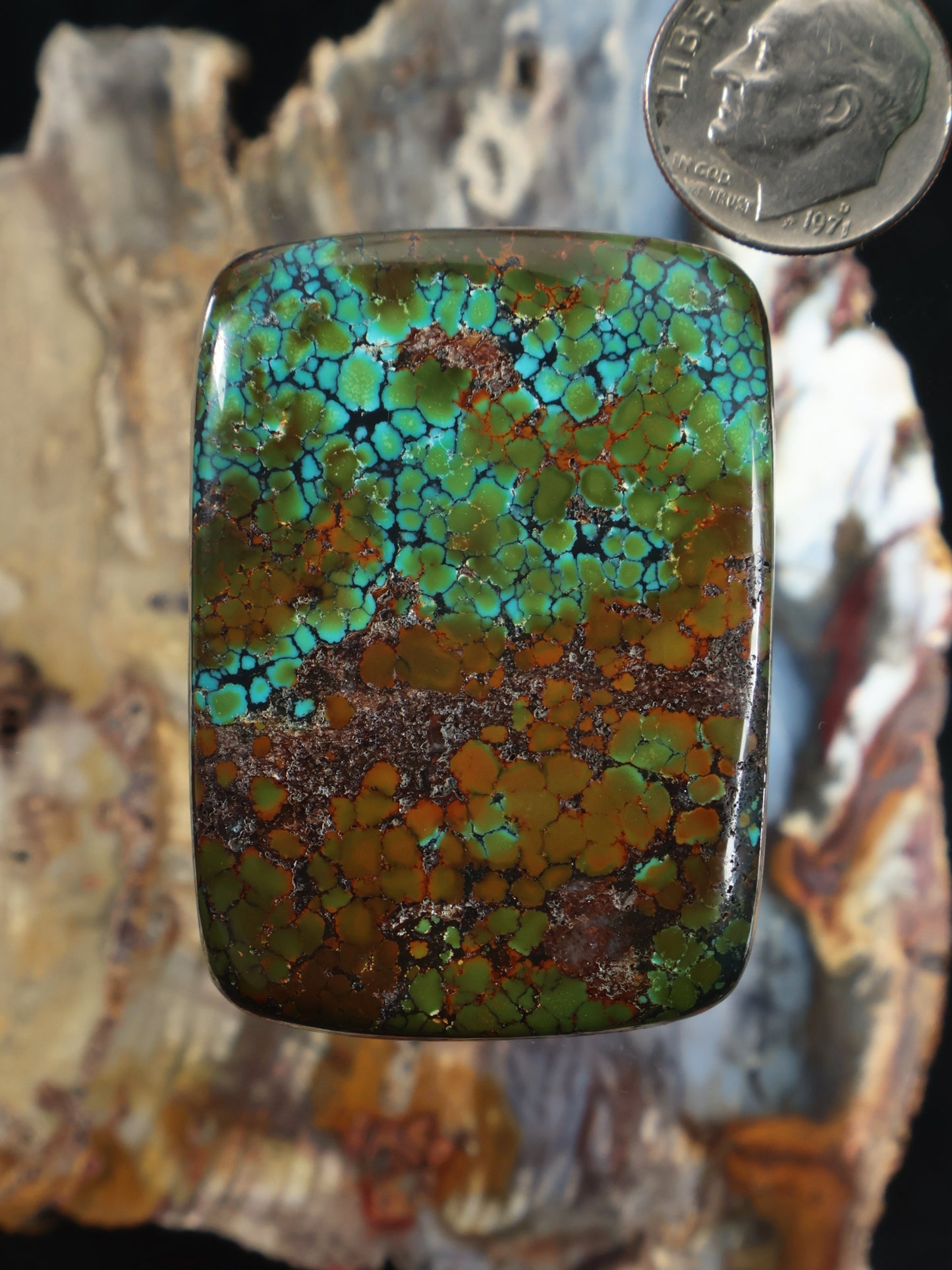 Turquoise and reddish-brown cabochon gemstone, domed square shape