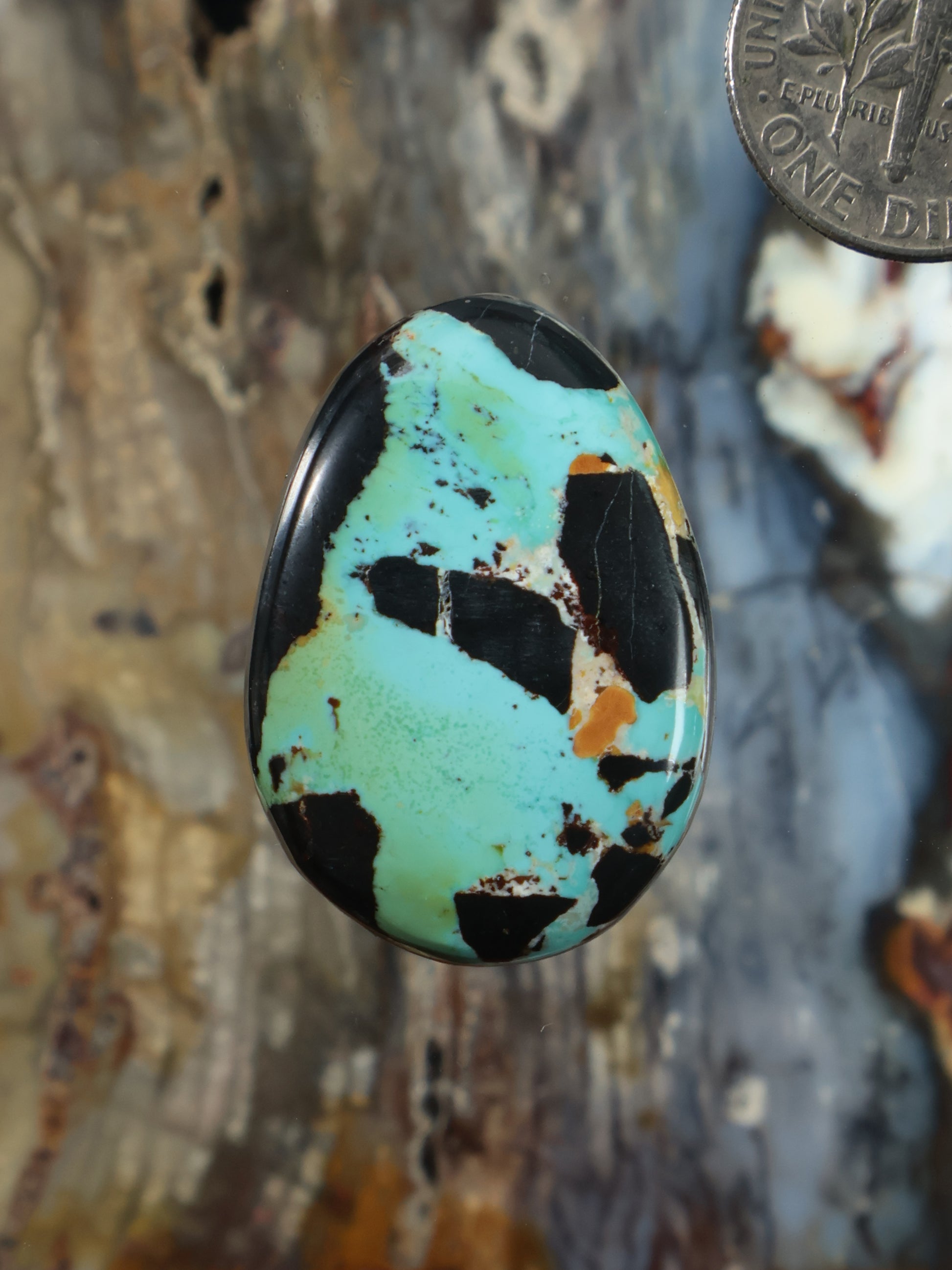 Turquoise cabochon gemstone with black matrix, teardrop shape