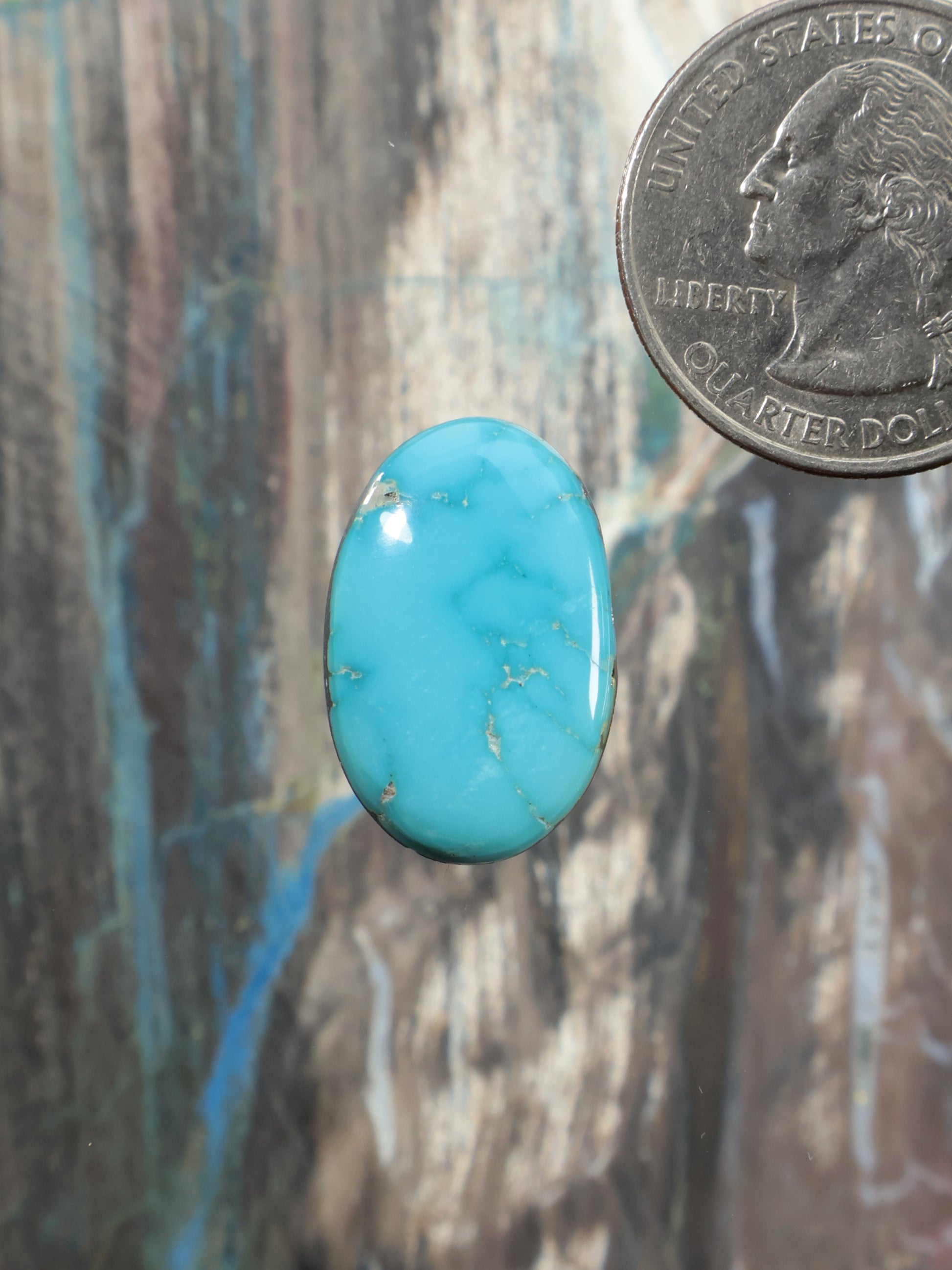 Sleeping Beauty turquoise oval cabochon gemstone with natural blue-green veining