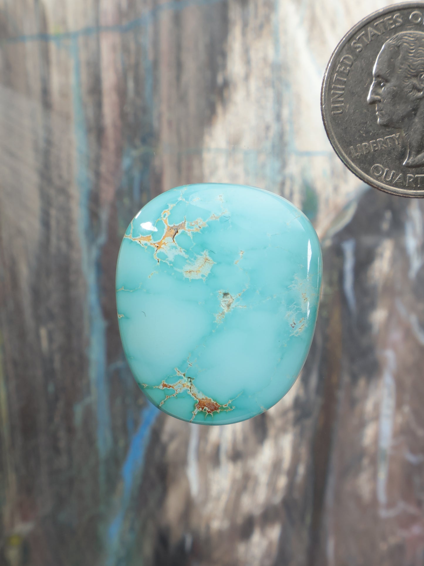 Royston turquoise oval cabochon gemstone with gold matrix veining, G109