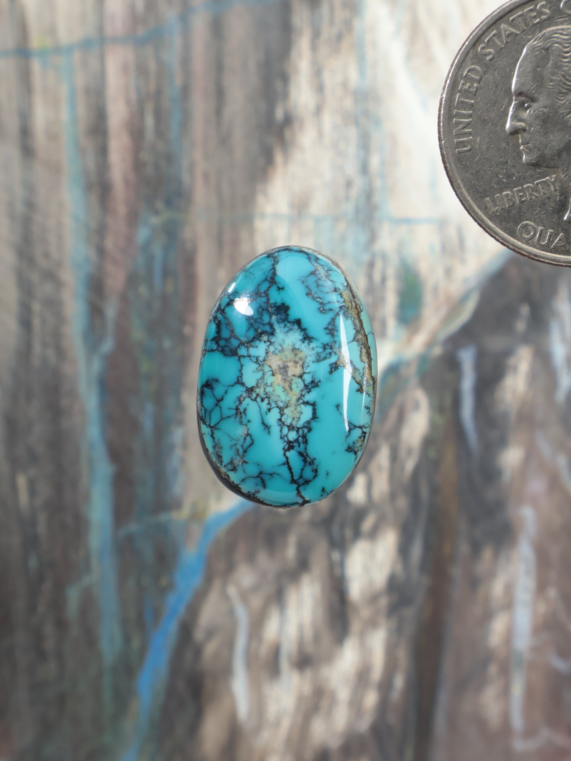 Labashan turquoise cabochon gemstone, oval blue with black veining