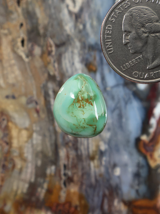 Turquoise cabochon gemstone, oval domed light green with natural matrix inclusions