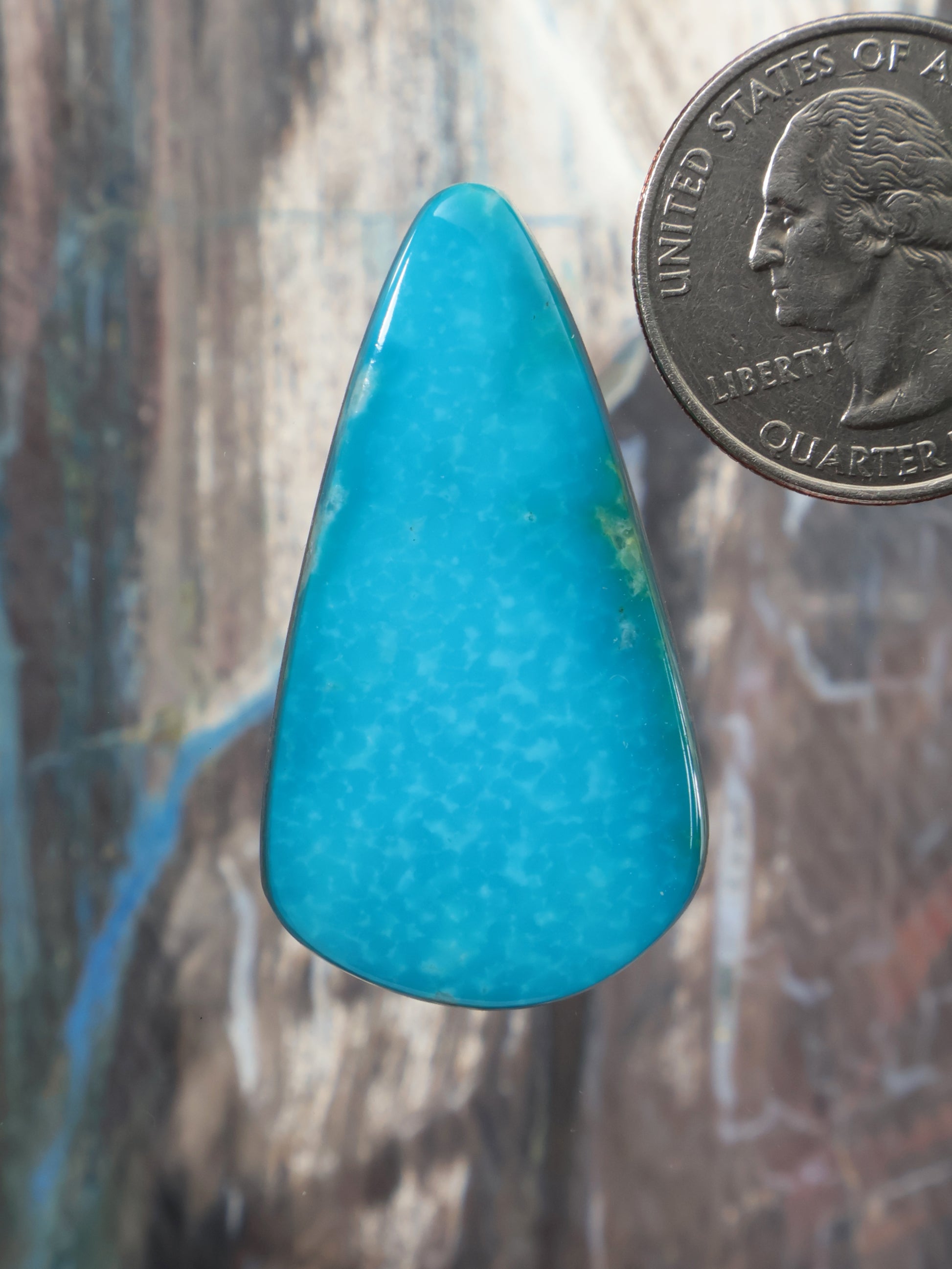 Turquoise cabochon gemstone in teardrop shape