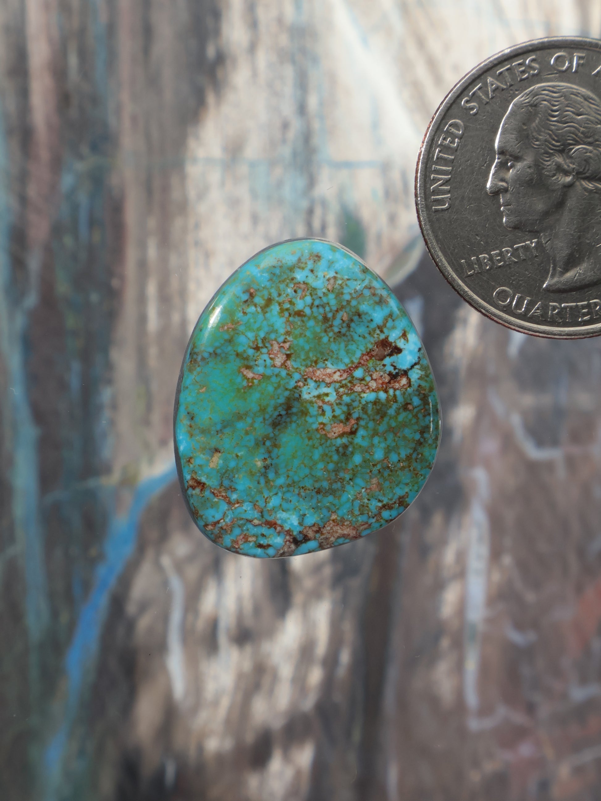 Turquoise polychrome cabochon, teardrop-shaped gemstone with speckled matrix detail