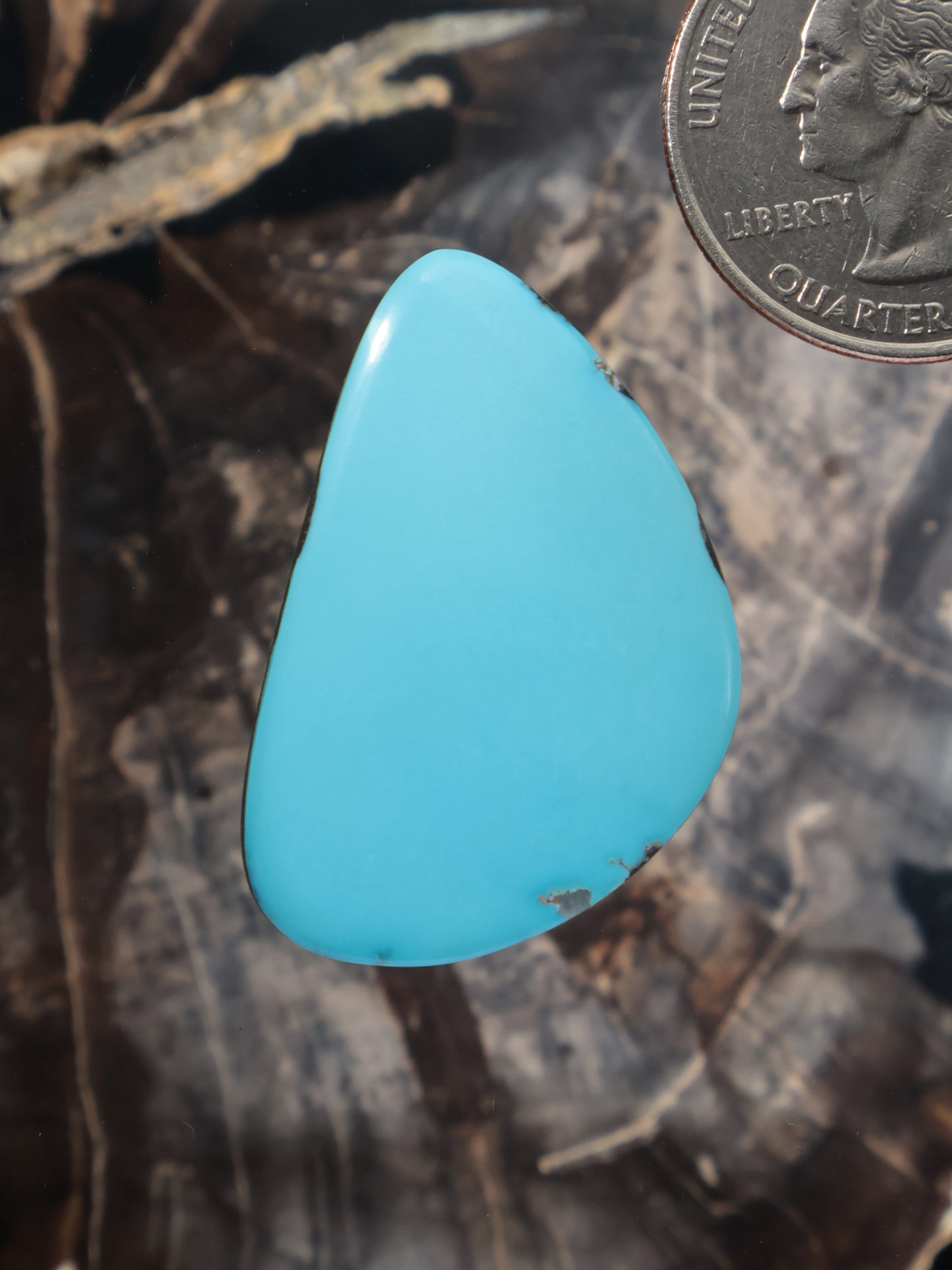 Turquoise oval cabochon gemstone with smooth polished surface