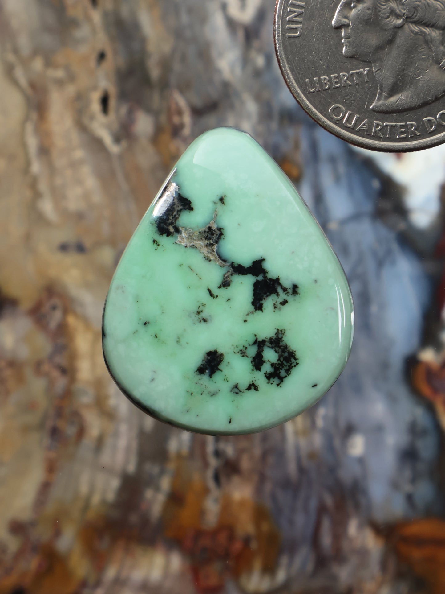 Mint green teardrop variscite cabochon with dark mineral webbing