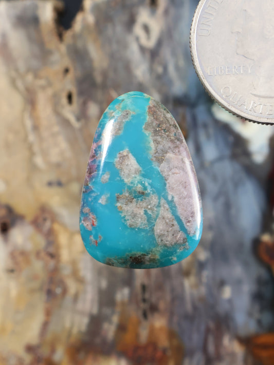 Morenci turquoise cabochon with teardrop shape and natural matrix veining
