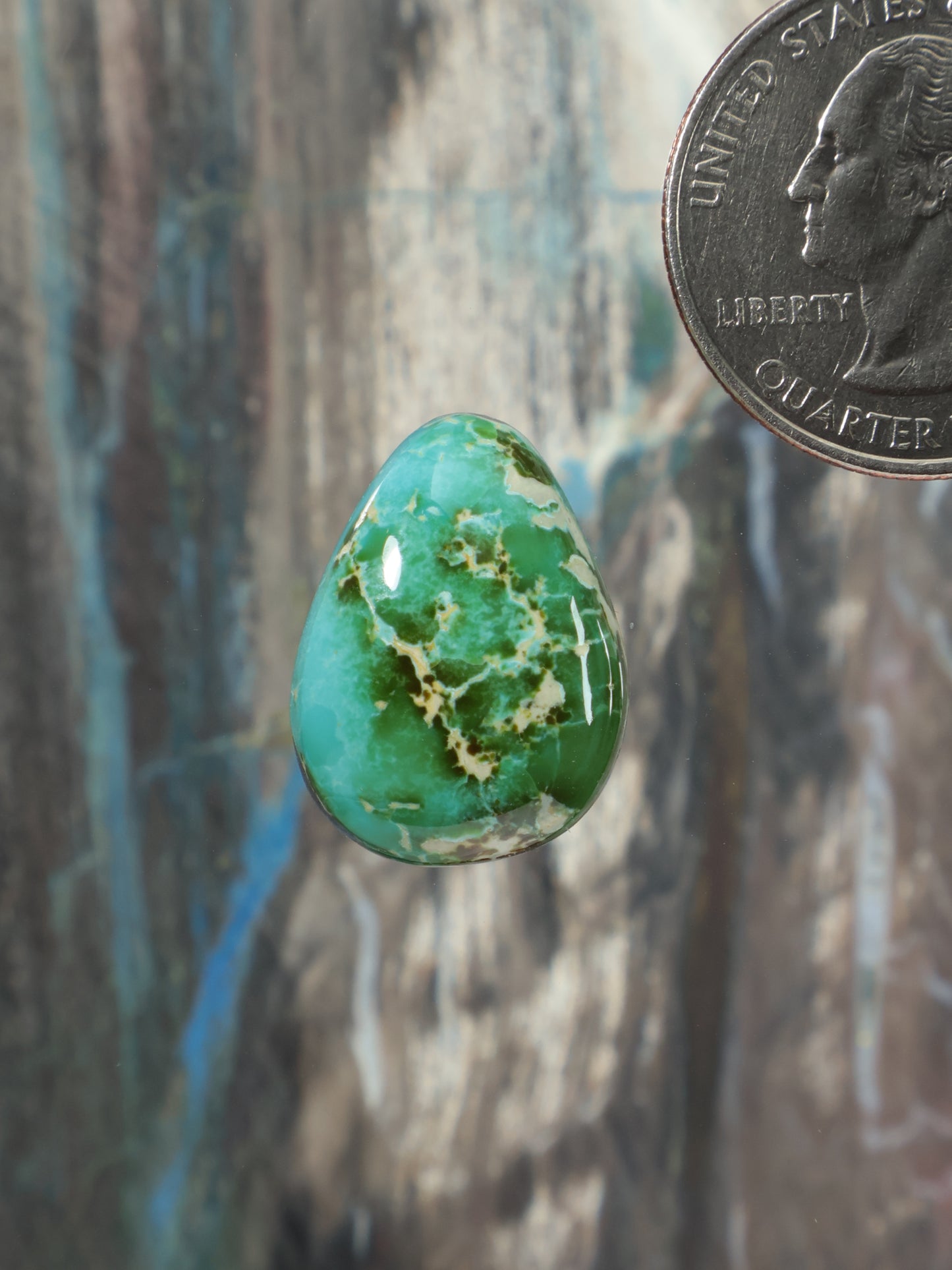 Teardrop turquoise cabochon gemstone with green-blue marbling