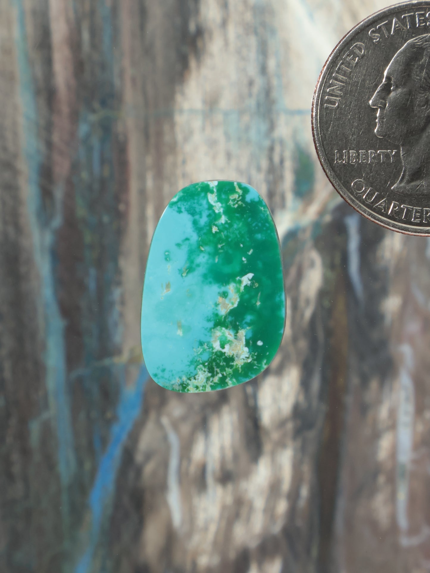 Turquoise cabochon gemstone with glossy oval teardrop cut