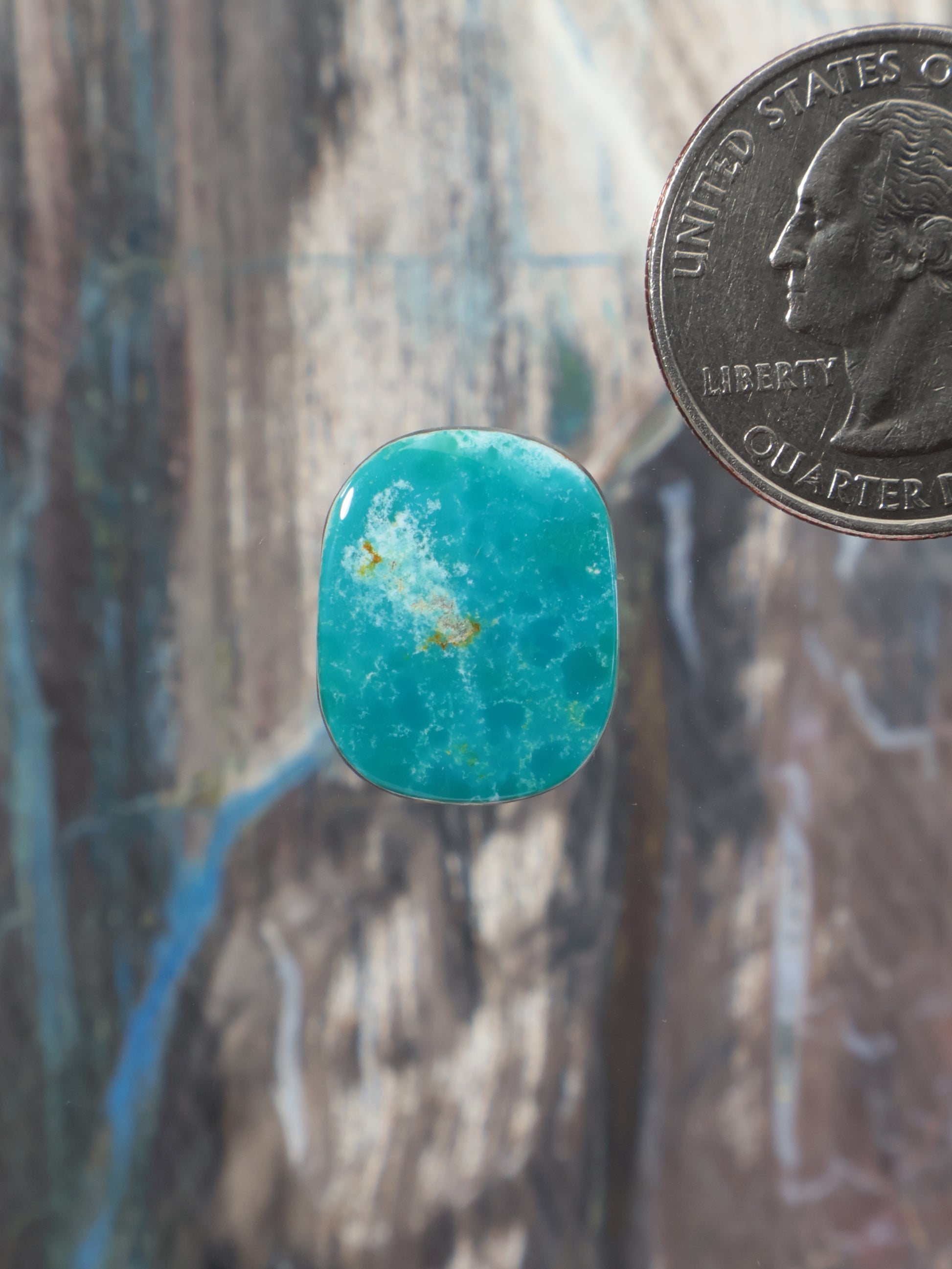 Turquoise cabochon gemstone with rounded-square shape and domed surface