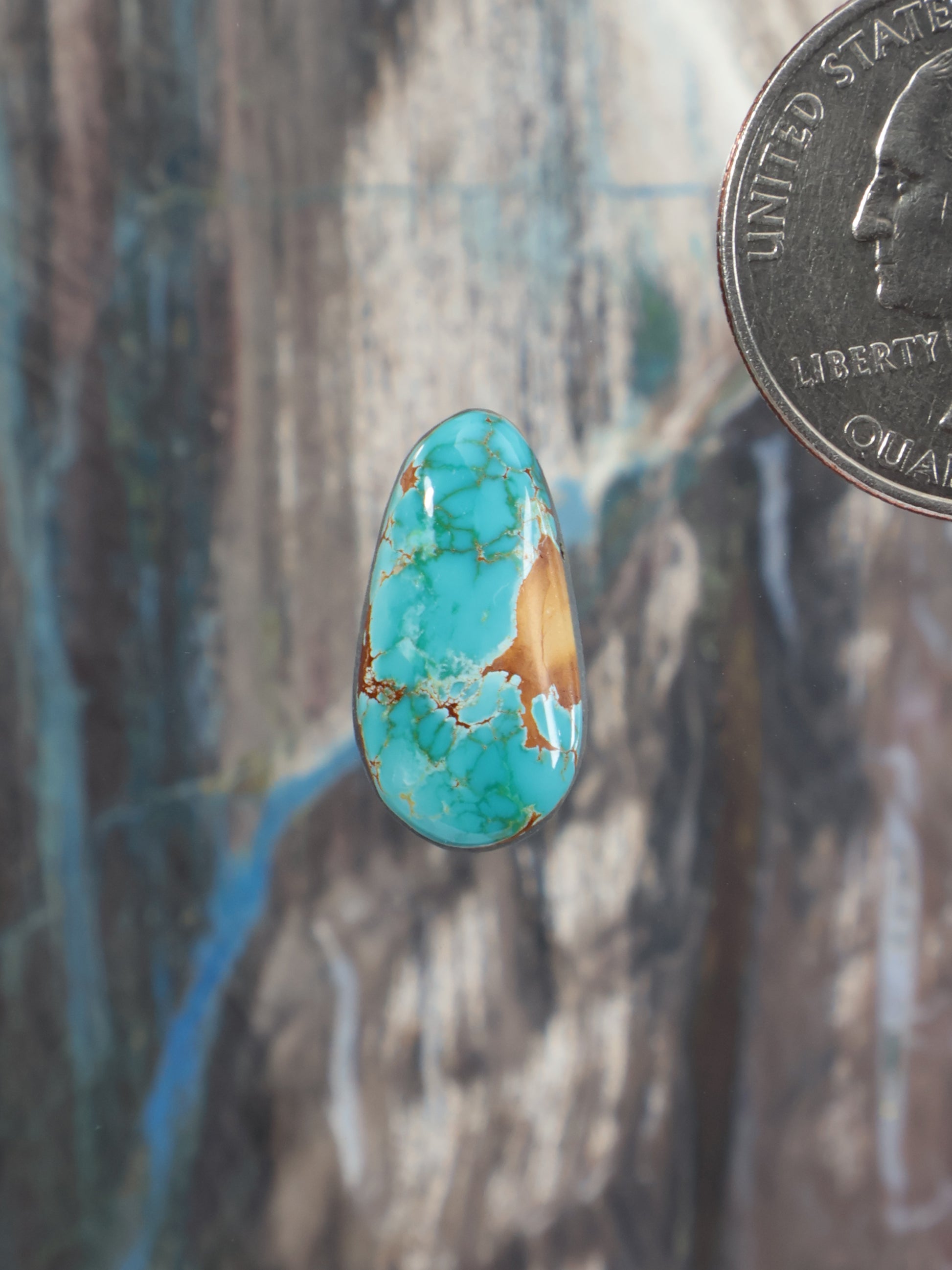Turquoise teardrop cabochon with gold backing