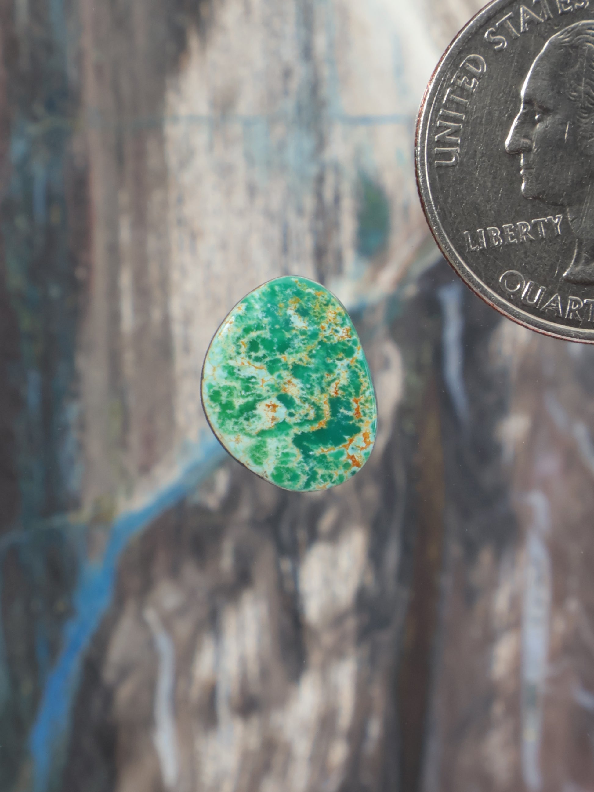 Turquoise cabochon with green speckled pattern, teardrop shape