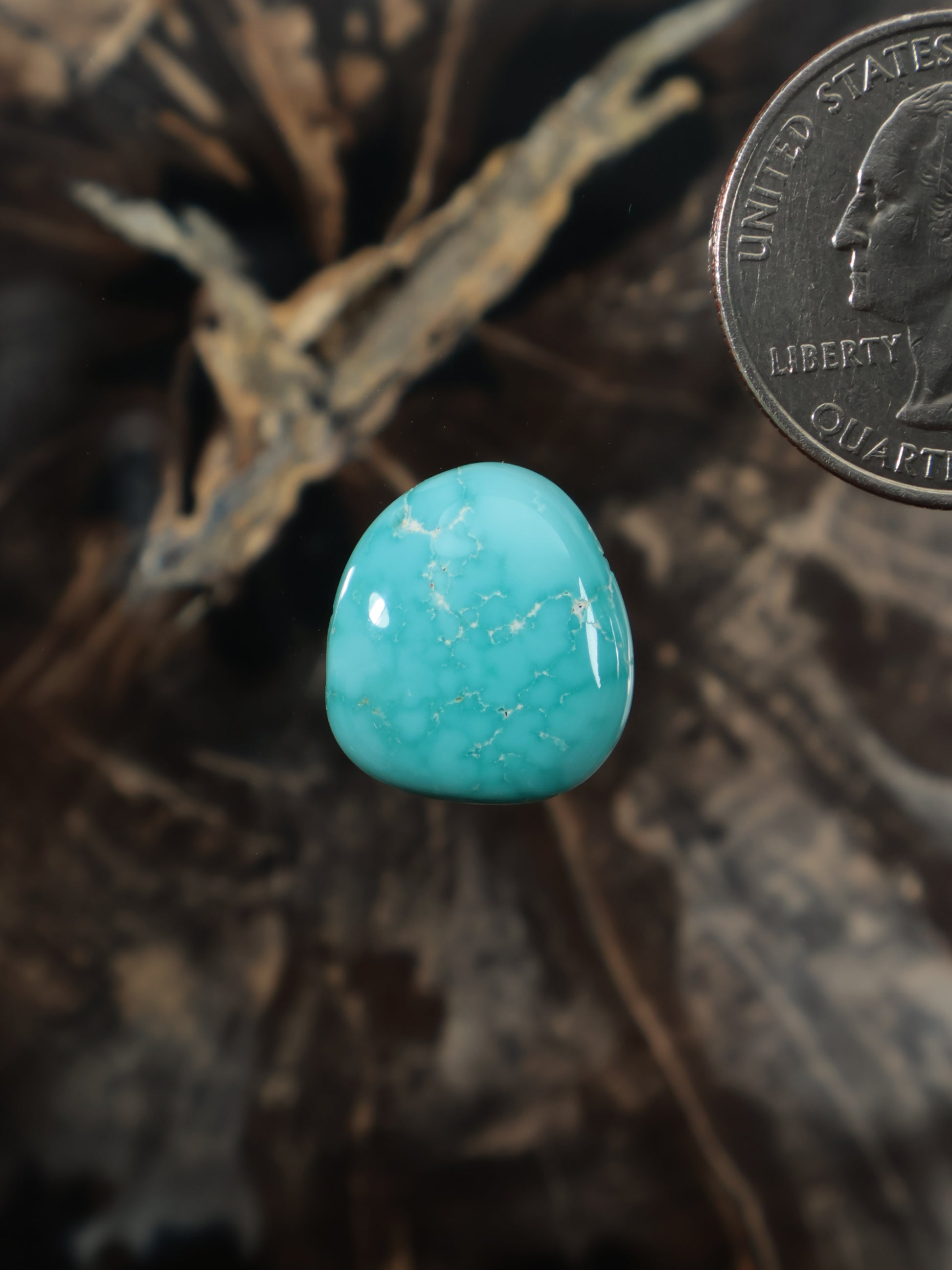 Turquoise cabochon gemstone, teardrop-shaped polished stone