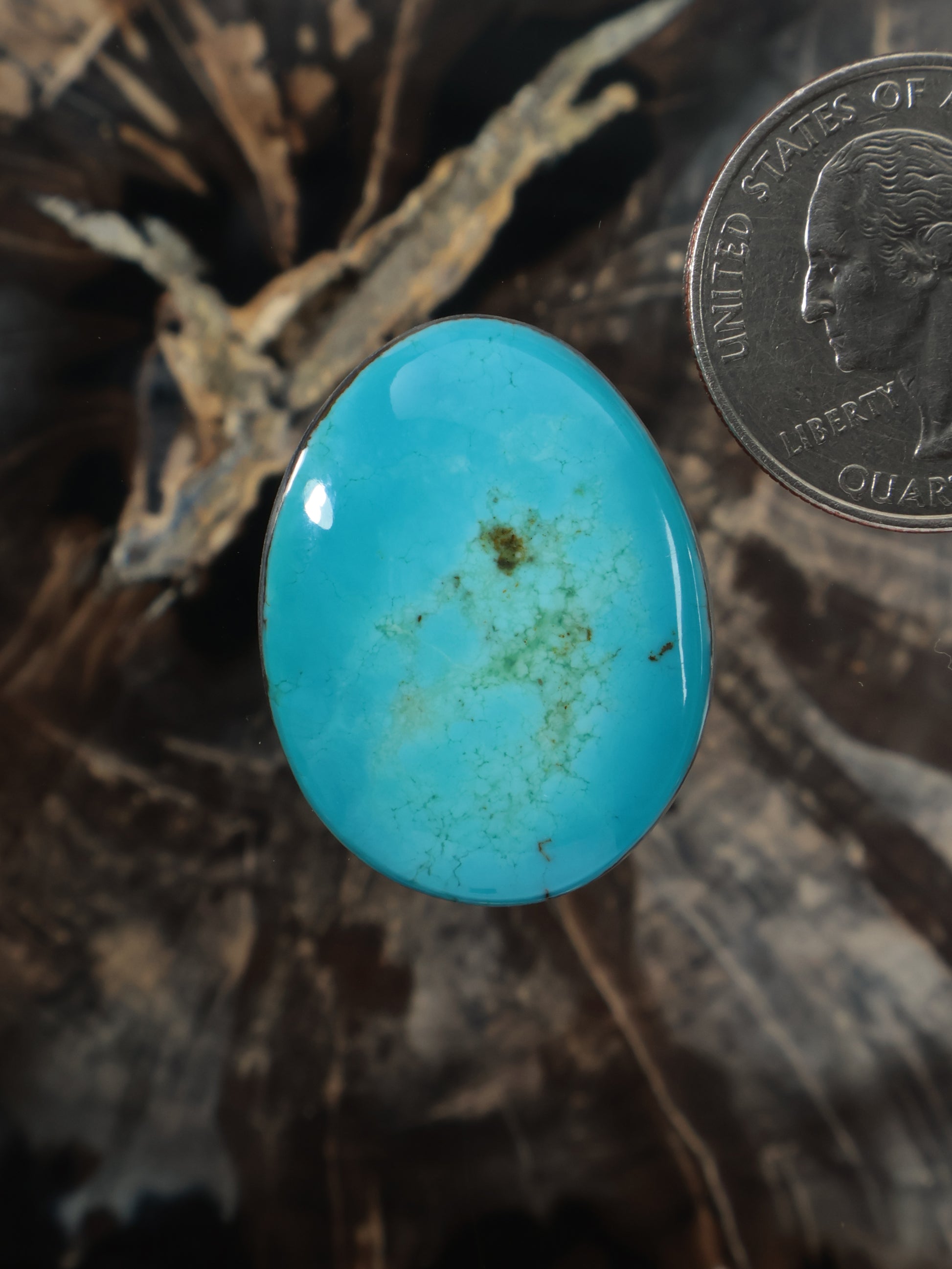 Turquoise cabochon gemstone, oval teardrop shape with smooth polished surface