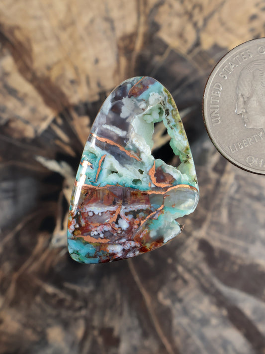 Multicolor teardrop cabochon gemstone with green, turquoise, and copper-brown bands
