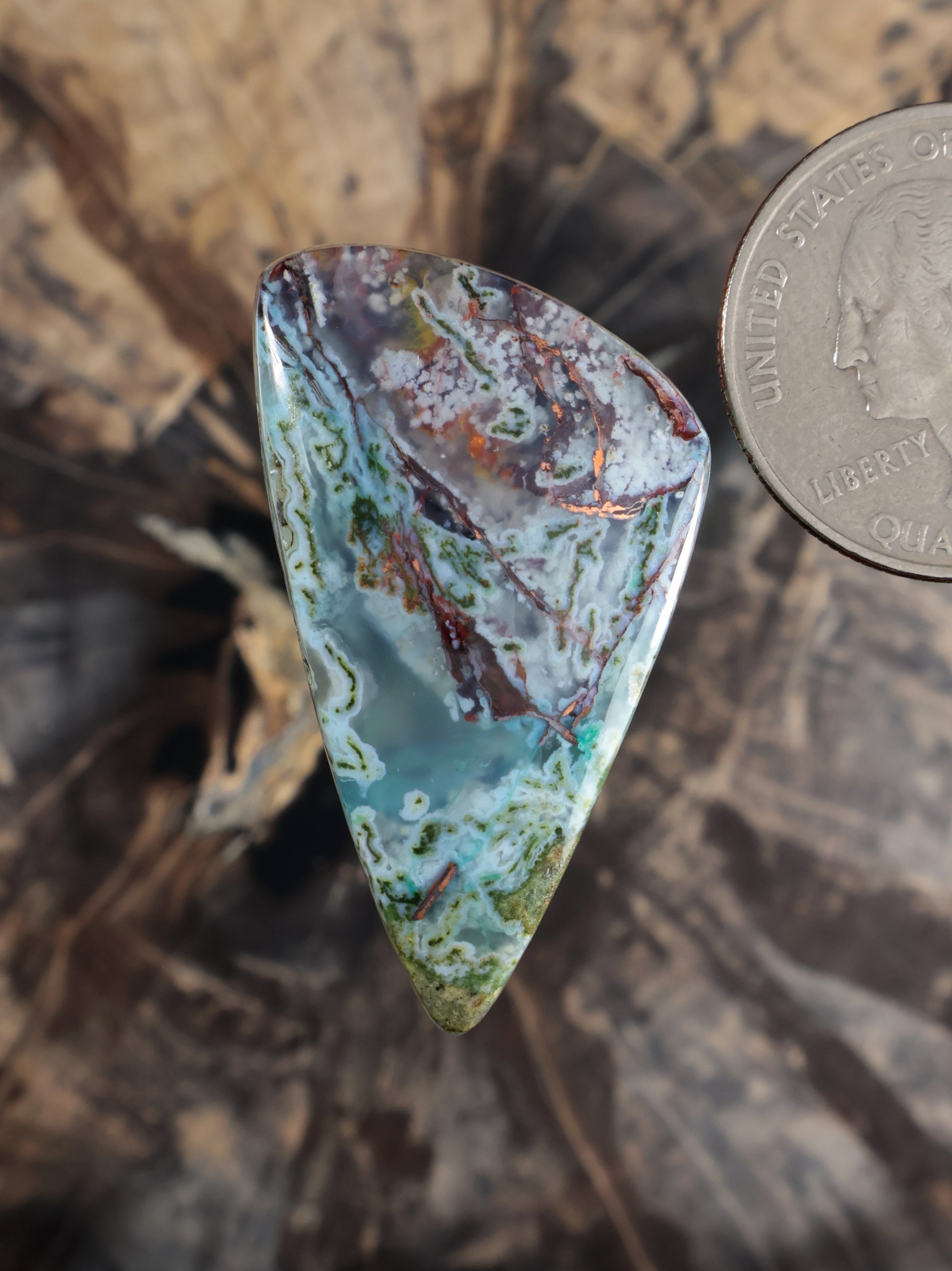 Teardrop chalcedony cabochon with green, blue and copper-brown veining