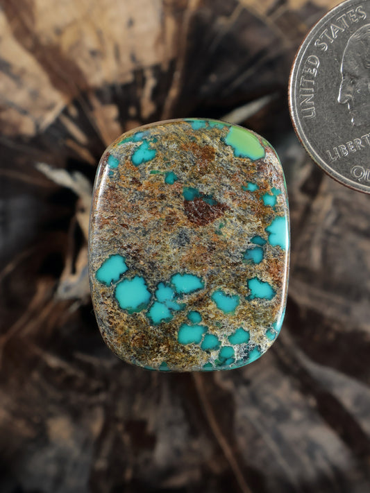 Moon River turquoise cabochon, oval stone with blue-green patches and tan matrix