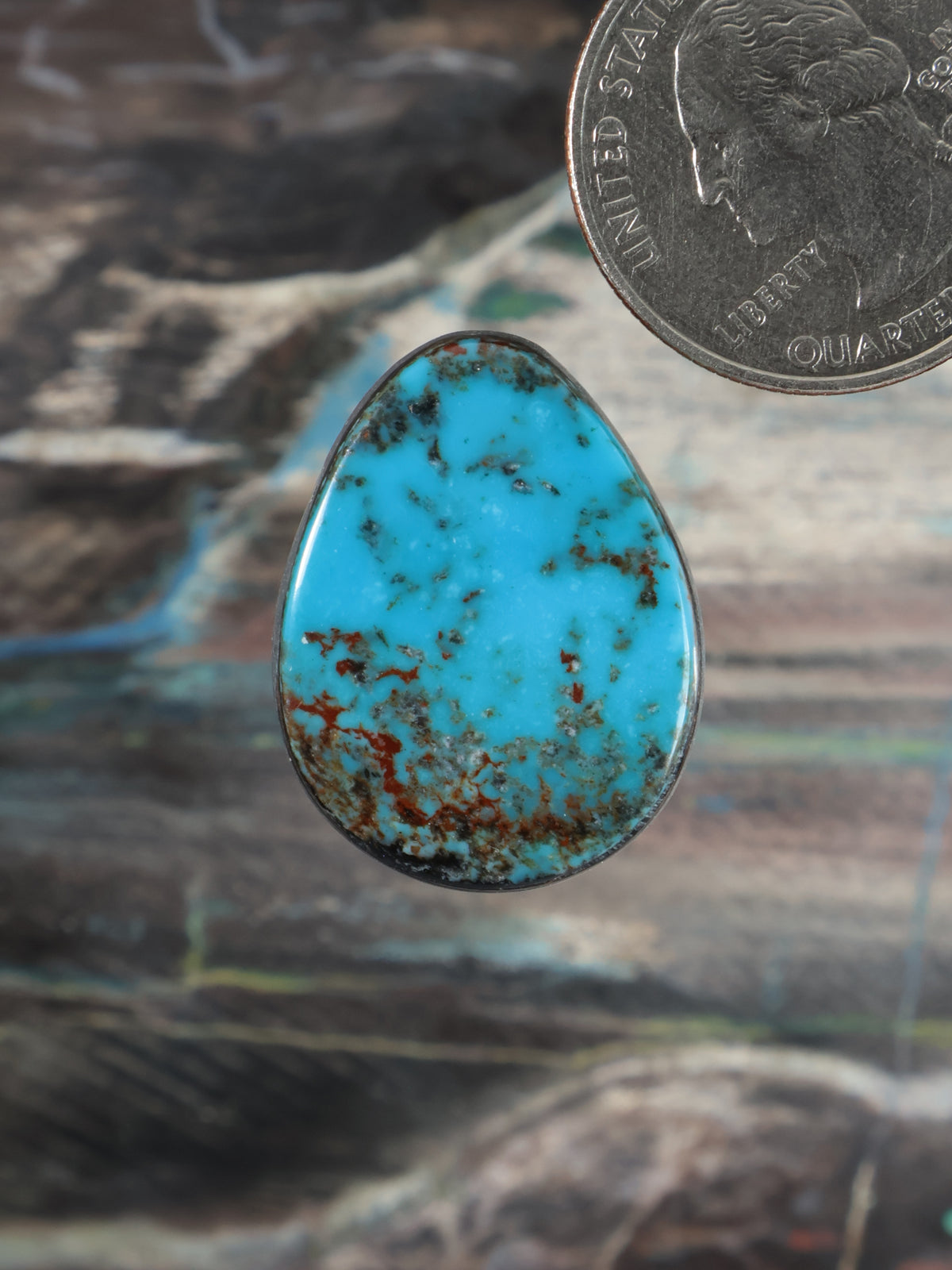 Teardrop turquoise cabochon with blue stone and brown matrix, silver-toned bezel