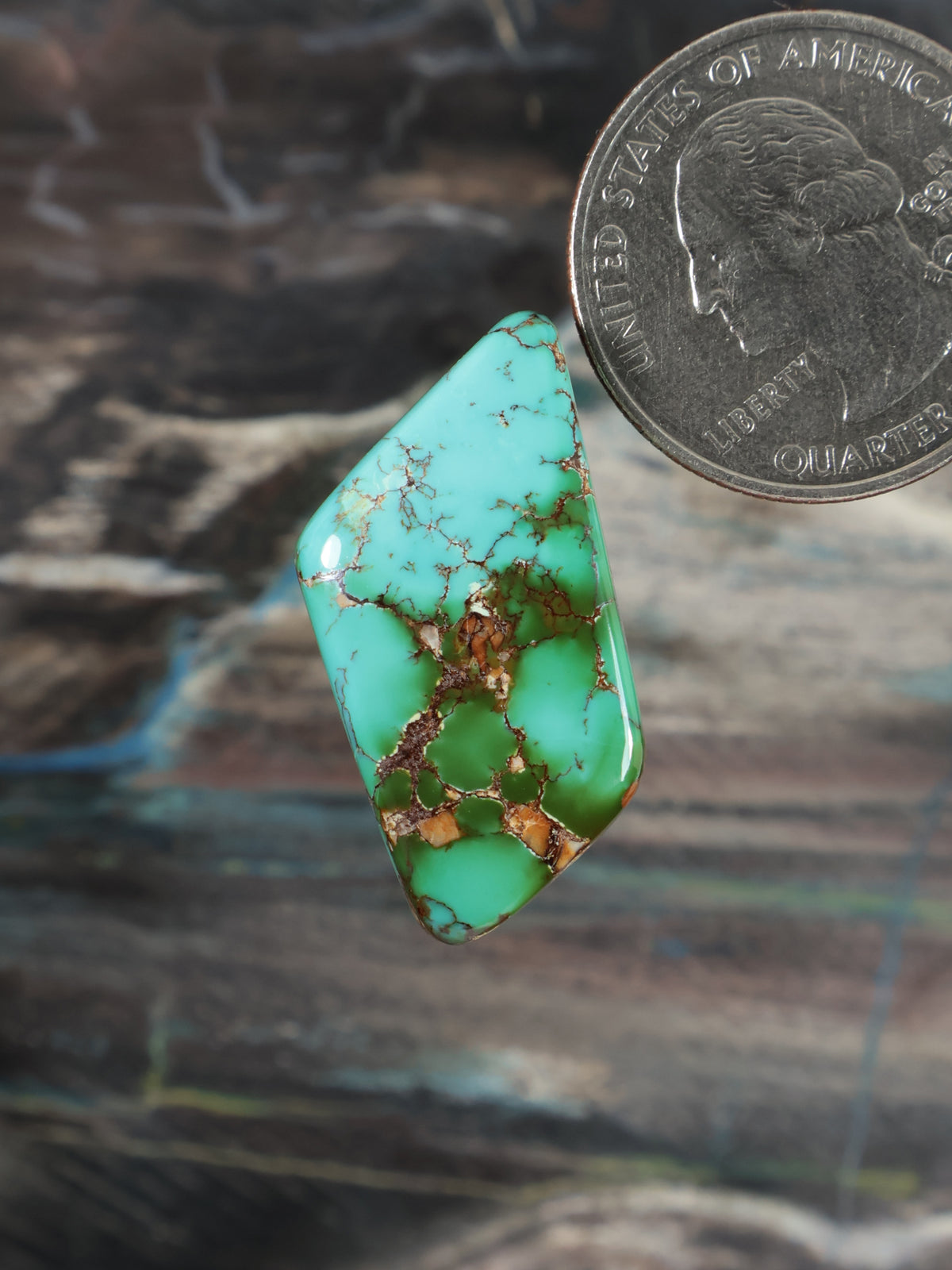 Teardrop turquoise cabochon with brown matrix, glossy stone