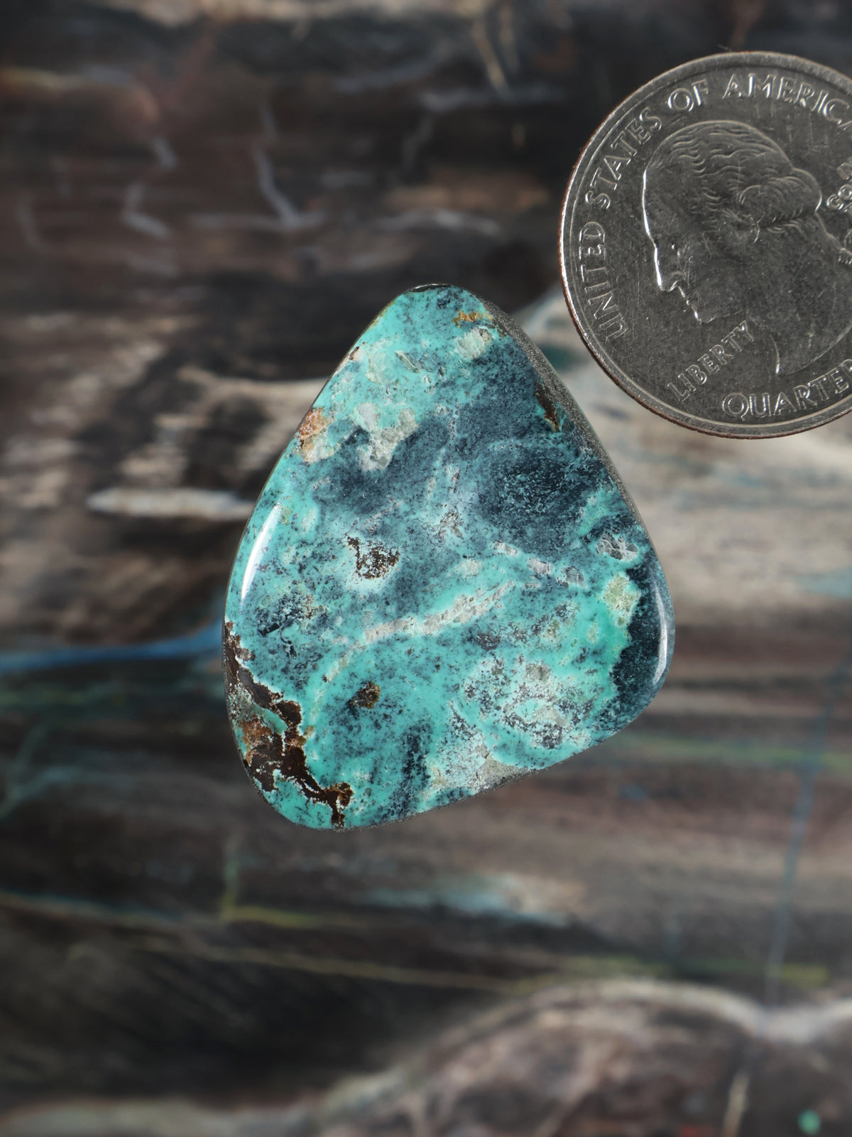 Turquoise cabochon gemstone, teardrop shape with blue-green color and natural matrix