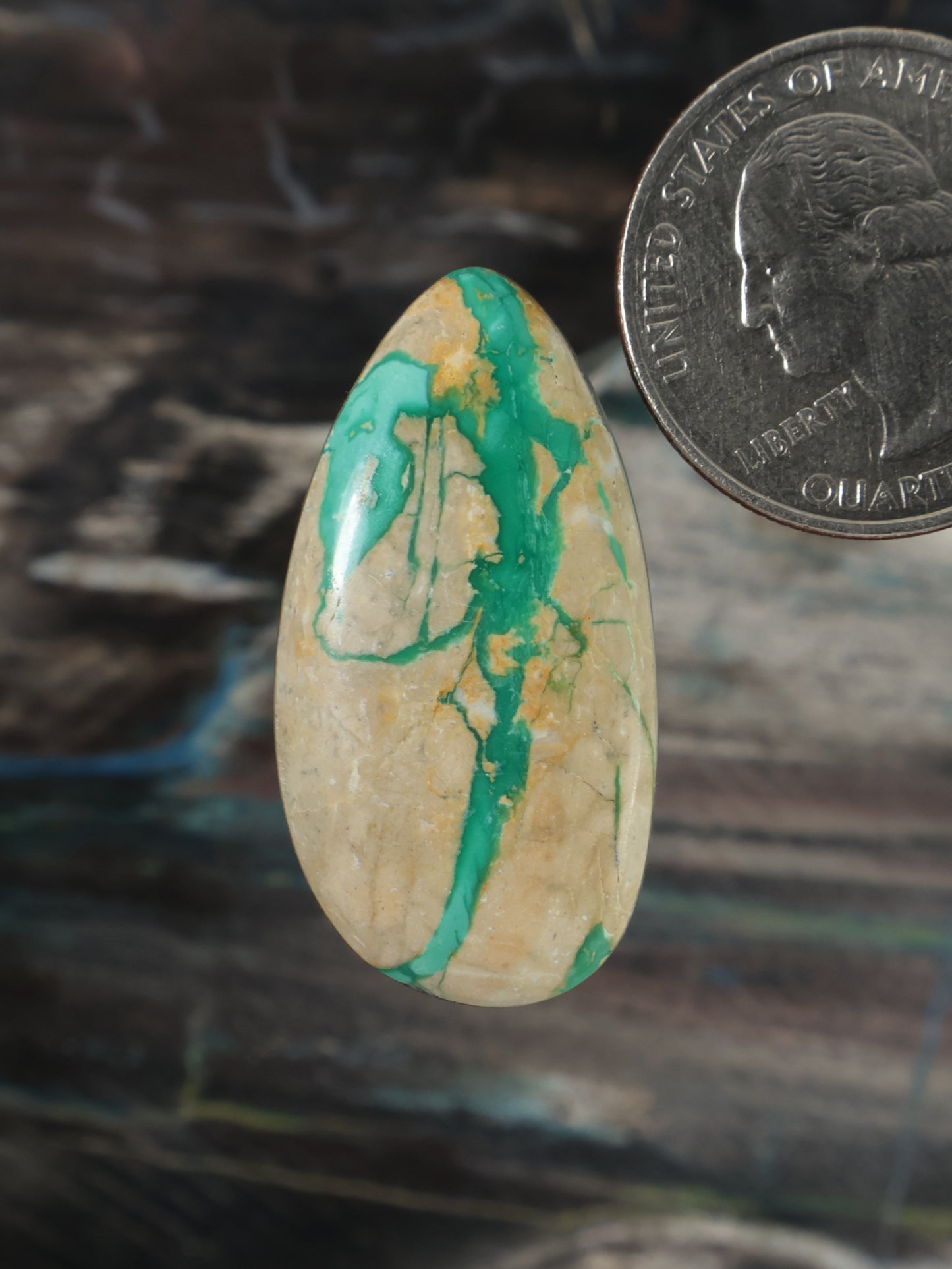 Royston ribbon turquoise cabochon, teardrop domed gemstone with green veining on beige base