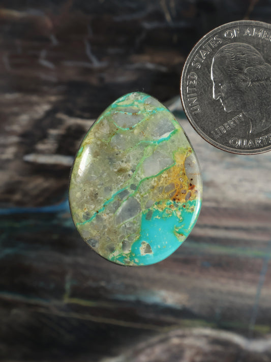 Oval turquoise cabochon with green veined matrix gemstone
