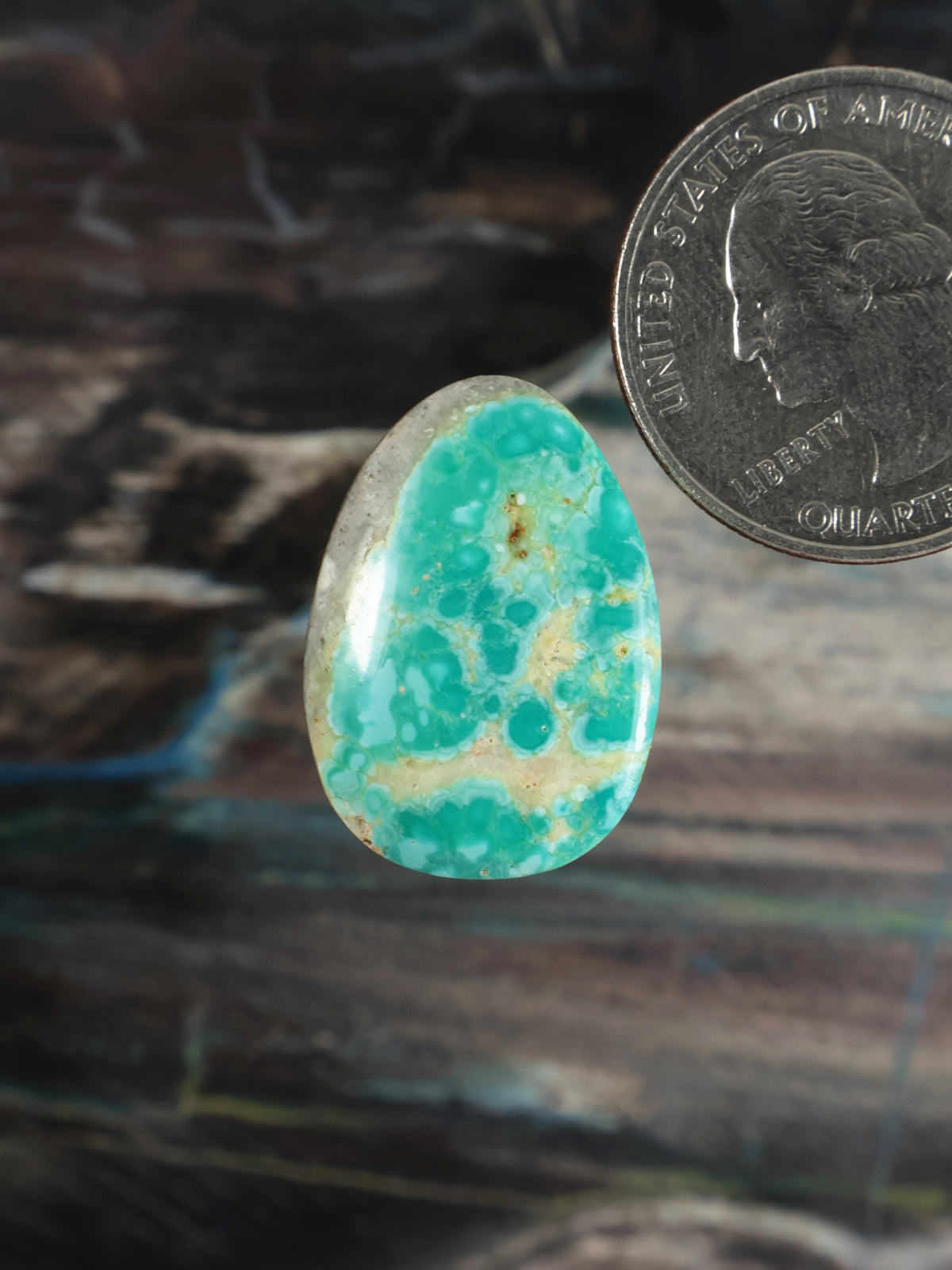 Royston turquoise oval cabochon gemstone with mottled aqua pattern