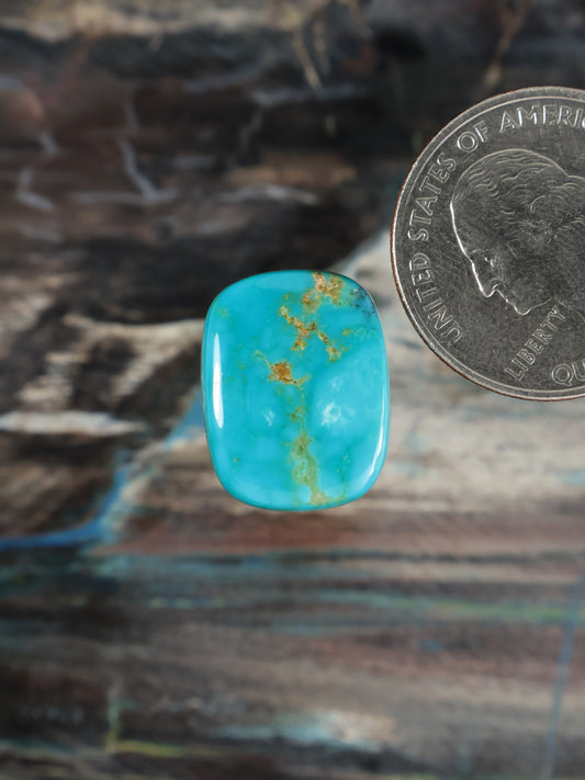 Turquoise gemstone cabochon with gold matrix flecks, rounded square shape