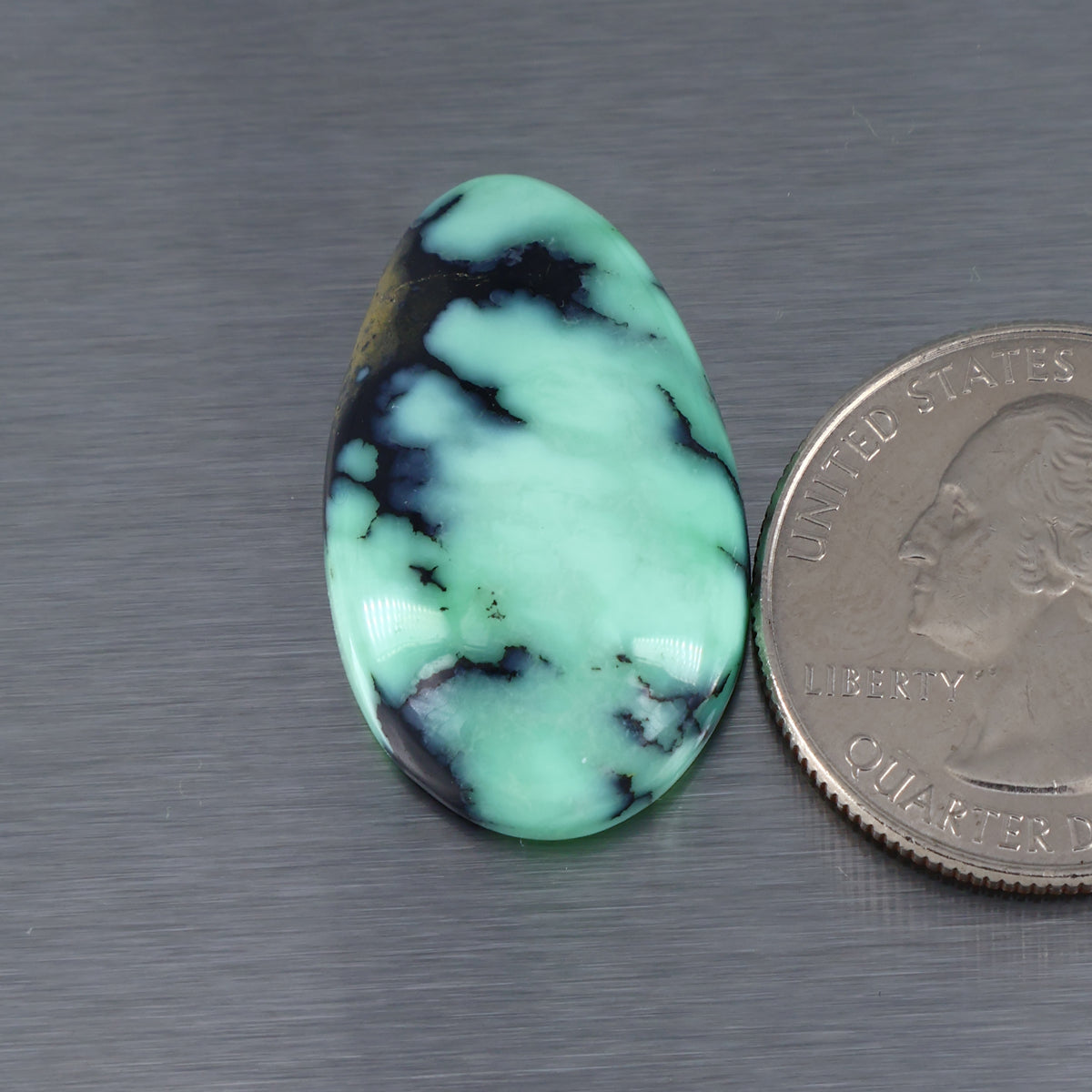 Teardrop variscite cabochon with mint-green and dark webbed veining