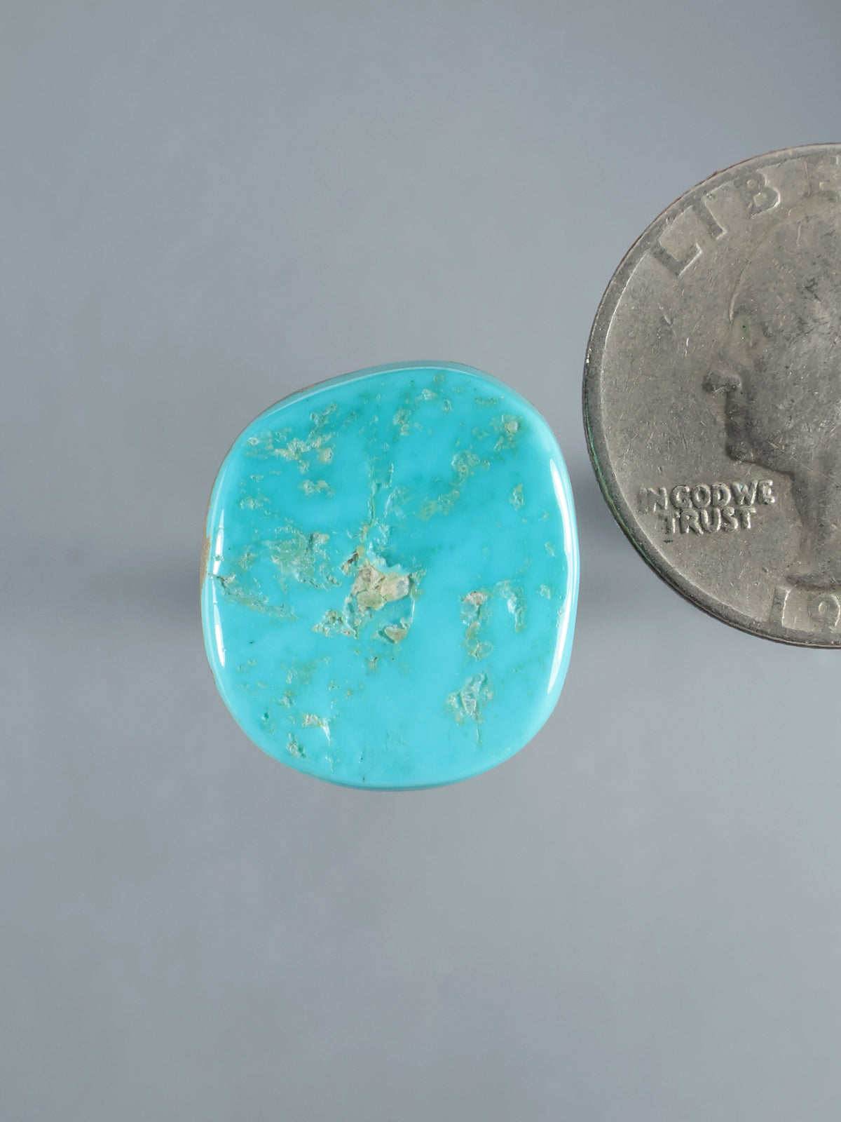 Natural Sleeping Beauty turquoise cabochon, polished oval stone with light brown matrix veining