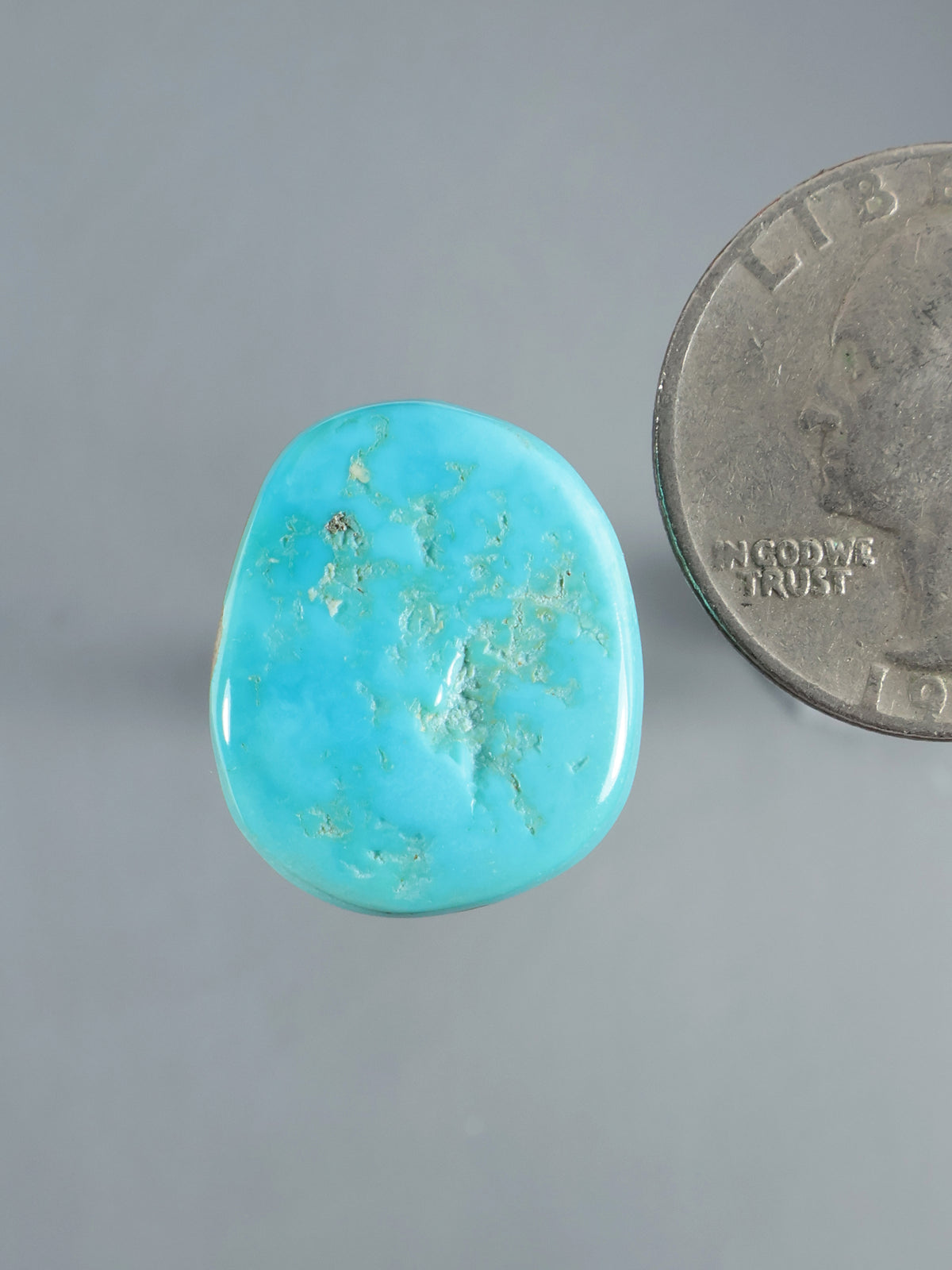 Natural Sleeping Beauty turquoise cabochon, polished oval stone with light brown veining