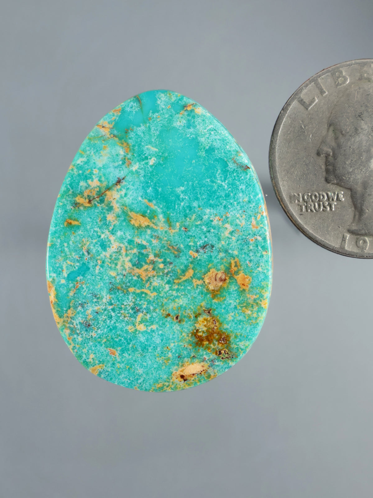 Hubei turquoise cabochon, oval polished stone with vivid blue-green color and natural brown matrix