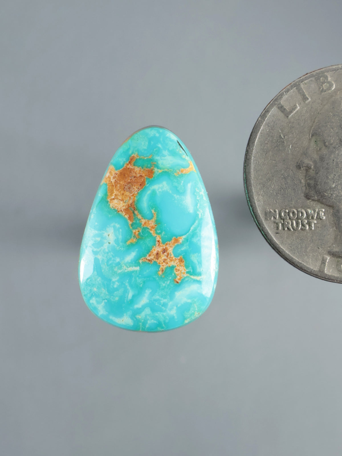 Hubei turquoise cabochon, polished teardrop stone with vivid blue-green color and brown matrix