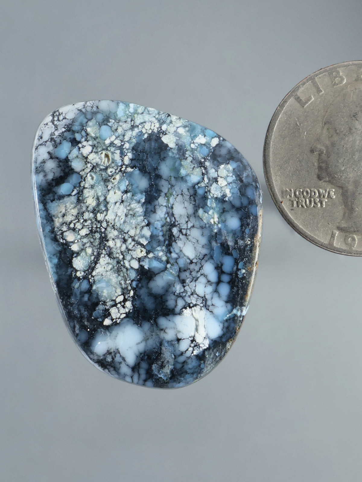 Wild Blue Cabochon B921, polished blue stone with intricate white and dark veining