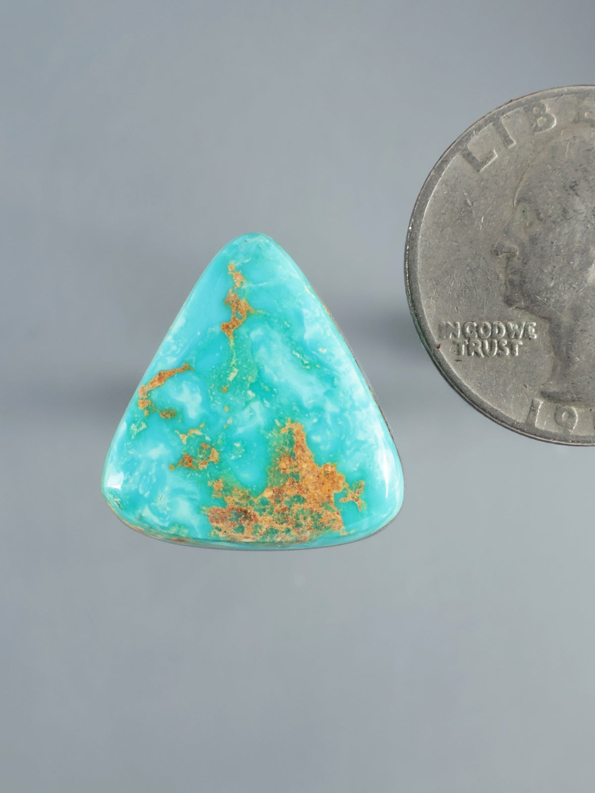 Hubei turquoise cabochon, triangular polished stone with vivid blue-green color and brown matrix